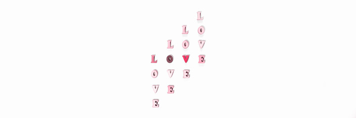 Love made wooden letters with hearts for Valentines Day. Banner.