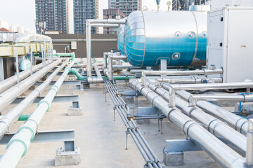 Utilities, Building utilities on rooftop. Rooftop of building. Water pipes system and hot water...