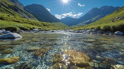 Fotobehang A clear mountain stream shining under midday sun texture background © Omizzoda