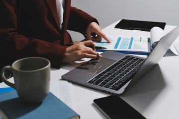 Tax deduction planning concept. Women use a calculator to calculate expenses and taxes to receive...
