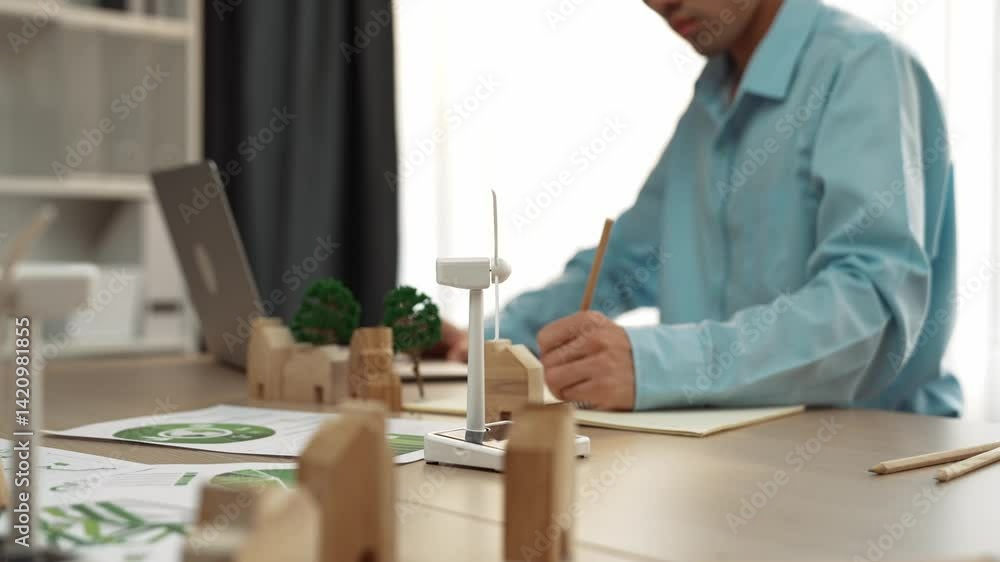 Poster windmill model represented using clean energy and wooden block symbolized ecology house. green power