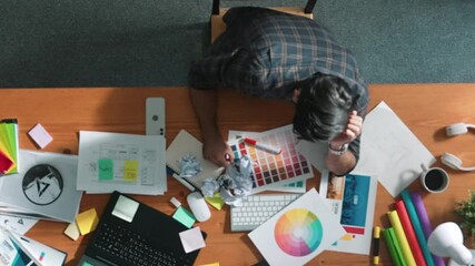 Top down view of designer work on palettes and crumpled paper. Top view of skilled business man run out of idea while sleeping at meeting table. Project manager crumpled and throw paper. Symposium.