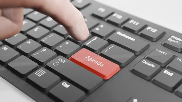 Hand About to Press Red "Agenda" Button on Black Keyboard, 3D Keyboard, Red Agenda Key Animation