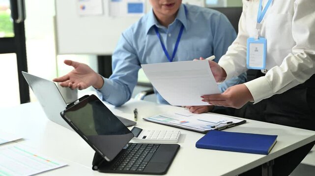 Kind leader executive manager share and discuss business solutions plan ideas on tablet