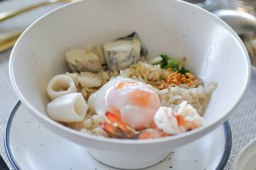 rice with soft boiled egg and seafood, seafood and rice