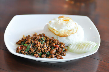 stir fried pork with holy basil , sunny side up egg and rice