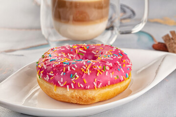 Sweet donut with strawberry icing