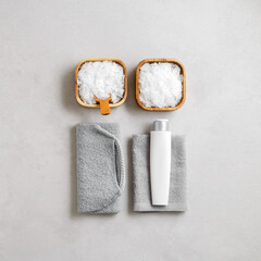 Spa, wellness, bath products as minimal style aesthetic pattern, magnesium salt flakes, folded grey towels, natural brushes, massagers, reusable pads, gray background, top view lifestyle content