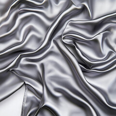 Fototapeta premium Shiny silver silk fabric with soft creases, isolated on white background, cloth