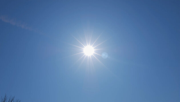 Radiant Sun in Clear Blue Sky: Capturing the dazzling brilliance of the sun against a backdrop of a cloudless azure sky, a photo to uplift and inspire.