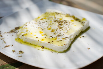 Cheese Greek feta cheese at the table