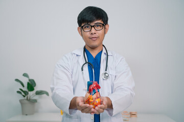 At the clinic, the cardiologist discussed the latest advancements in cardiology with the patient, emphasizing the importance of regular health check-ups for disease prevention and care.