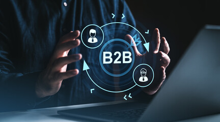 Businessman interacting with B2B digital interface displaying business-to-business icons and network symbols in creative style on technology background.