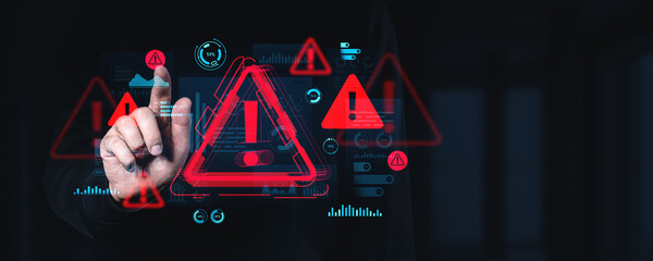 Cybersecurity warning system interface with alert symbols and data visualization on dark technology...