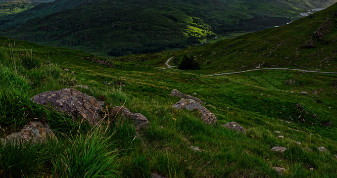 Exploring the Lush Green Hills of Blackvalley, Ireland, Under a Soft Sunlight.