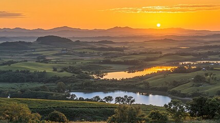 Obraz premium Sunrise over tranquil lake, rolling hills, mountain vista