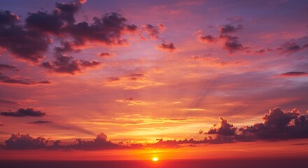 Fototapeta premium Vibrant Sunset Sky with Clouds and Golden Light Rays