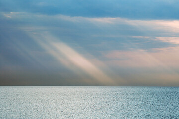 sun rays coming out from the clouds