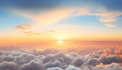 Beautiful sunset scene showing a vast sky filled with soft fluffy clouds illuminated by warm orange and pink sunlight, creating a peaceful and glowing atmosphere above the horizon
