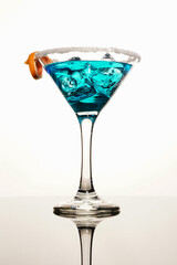 Cocktail drink on ice with fruit isolated at white
