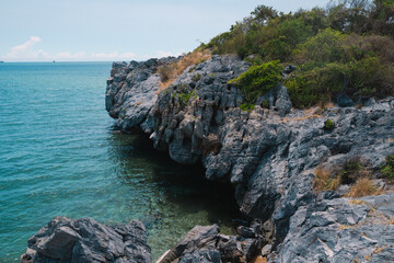 The island's beach glowed under the summer sky, where ocean waves met the shore; a perfect blend of sea, water, and nature, calling every soul to travel and explore.