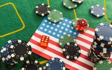 Chips from casino. USA flag. Gambling industry in united states. Casino chips are scattered on steel. Gambling business in las Vegas concept. Casinos in US. Gambling in USA. Poker, roulette