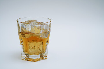 Cocktail drink on ice with fruit 
