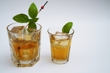 Cocktail drink on the rocks with fruit isolated
