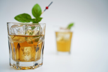 Cocktail drink on the rocks with fruit isolated