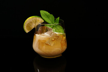 Cocktail drink on the rocks with fruit isolated