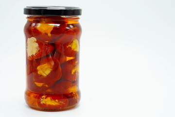 Pickles peppers tomatoes carrots chili homemade food in vase isolated at white
