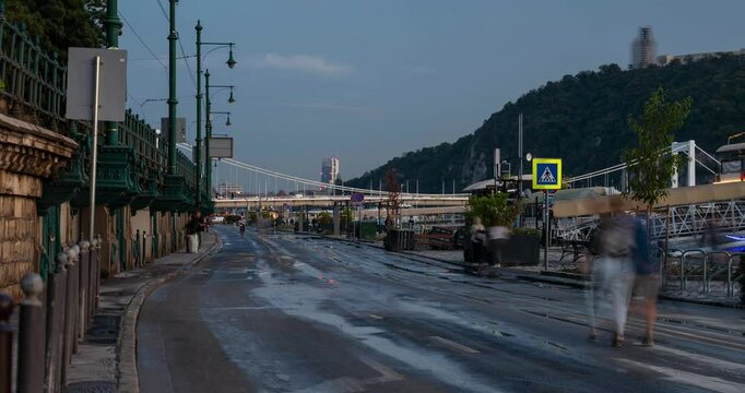 Budapest, Hungary - September 24, 2024: Glistening Aftermath: Pesti als&oacute; rkp. Under Watery Siege. Timelapse, zoom out transition.