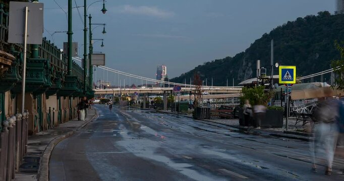 Budapest, Hungary - September 24, 2024: Glistening Aftermath: Pesti als&oacute; rkp. Under Watery Siege. Timelapse, zoom in transition.
