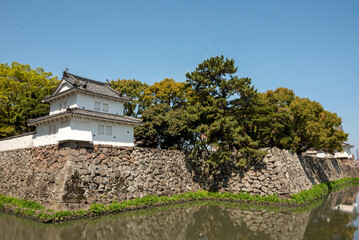 Traditional Japanese castle wall and turret by a moat in Oita, Japan © Don