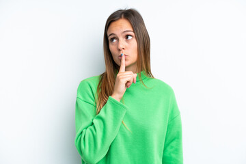 Young caucasian woman isolated on white background showing a sign of silence gesture putting finger...