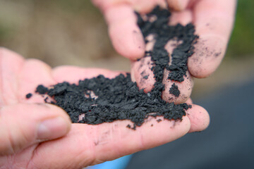 Close-up of biochar, produced through wood pyrolysis, a sustainable solution for carbon sequestration. Ideal for themes around CO2 reduction, climate change, and eco-friendly technology