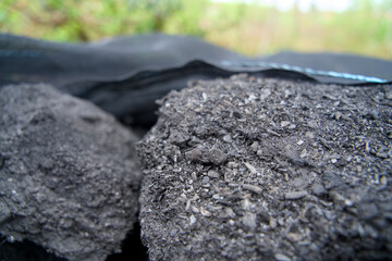 Close-up of biochar, produced through wood pyrolysis, a sustainable solution for carbon sequestration. Ideal for themes around CO2 reduction, climate change, and eco-friendly technology