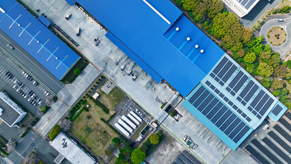 Directly above aerial view of a factory-lined industrial area