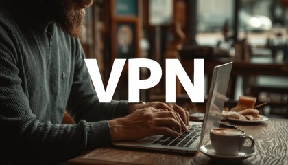Man Using VPN on Laptop, Ensuring Internet Privacy and Security While Working Remotely in Cafe