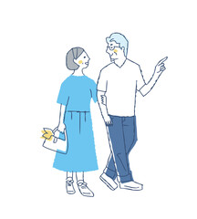 並んで歩いている笑顔のミドル・シニアカップル