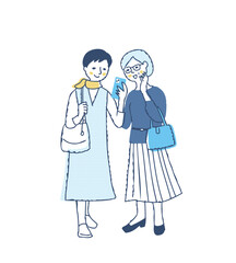 笑顔で一緒にスマホを見ている中年女性2人