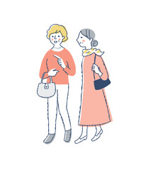 笑顔で一緒に歩くシニア女性2人