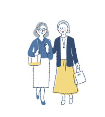 笑顔で一緒に歩くシニア女性2人