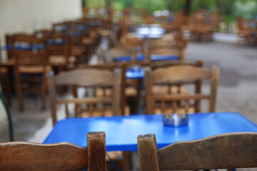 Table and chairs vintage wooden handmade at tavern restaurant
