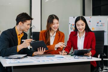 Asian business team collaboration, office project review or strategy meeting.