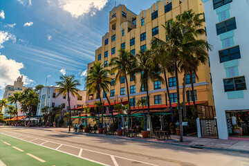 A view of backlit art deco buildings on Ocean drive beside the South Beach in Miami in springtime