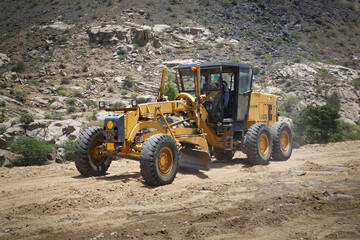 Construction machine motor grader during road