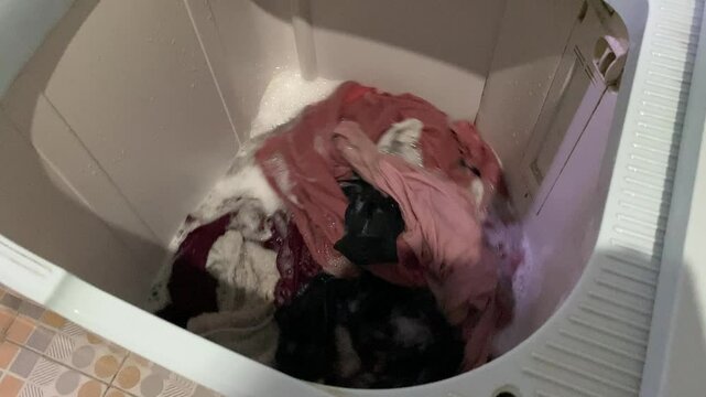 Washing clothes process inside top load washing machine