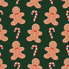 Seamless pattern with gingerbread man and candy cane on a dark green background. Vector holiday background.