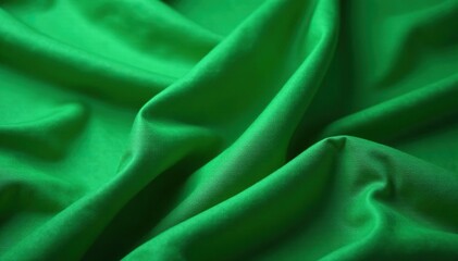 Fototapeta premium Deep green cloth loosely coiled, showing folds and wrinkles, photography, organic, background